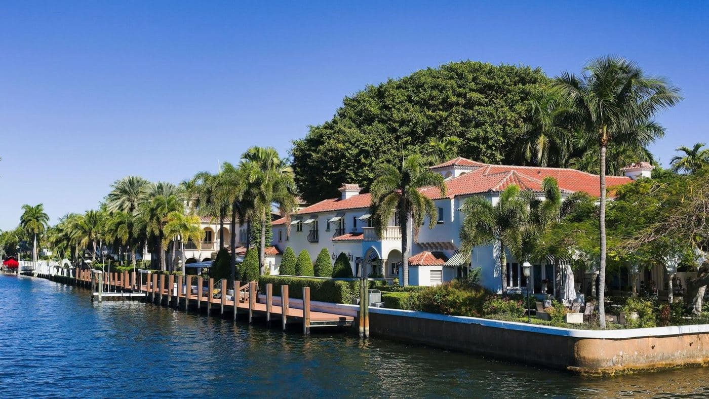 A canal lined with seawalls and waterfront homes